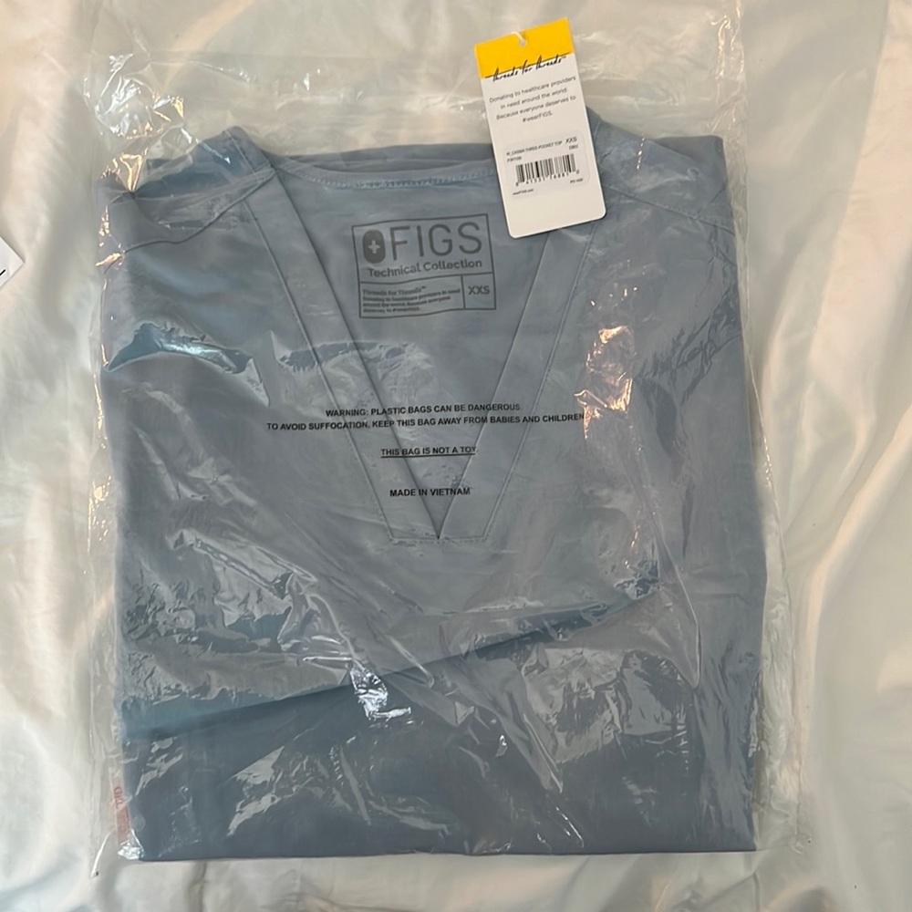 Wearfigs scrub top in style casma , color dusted blue, size xxs. Brand new!